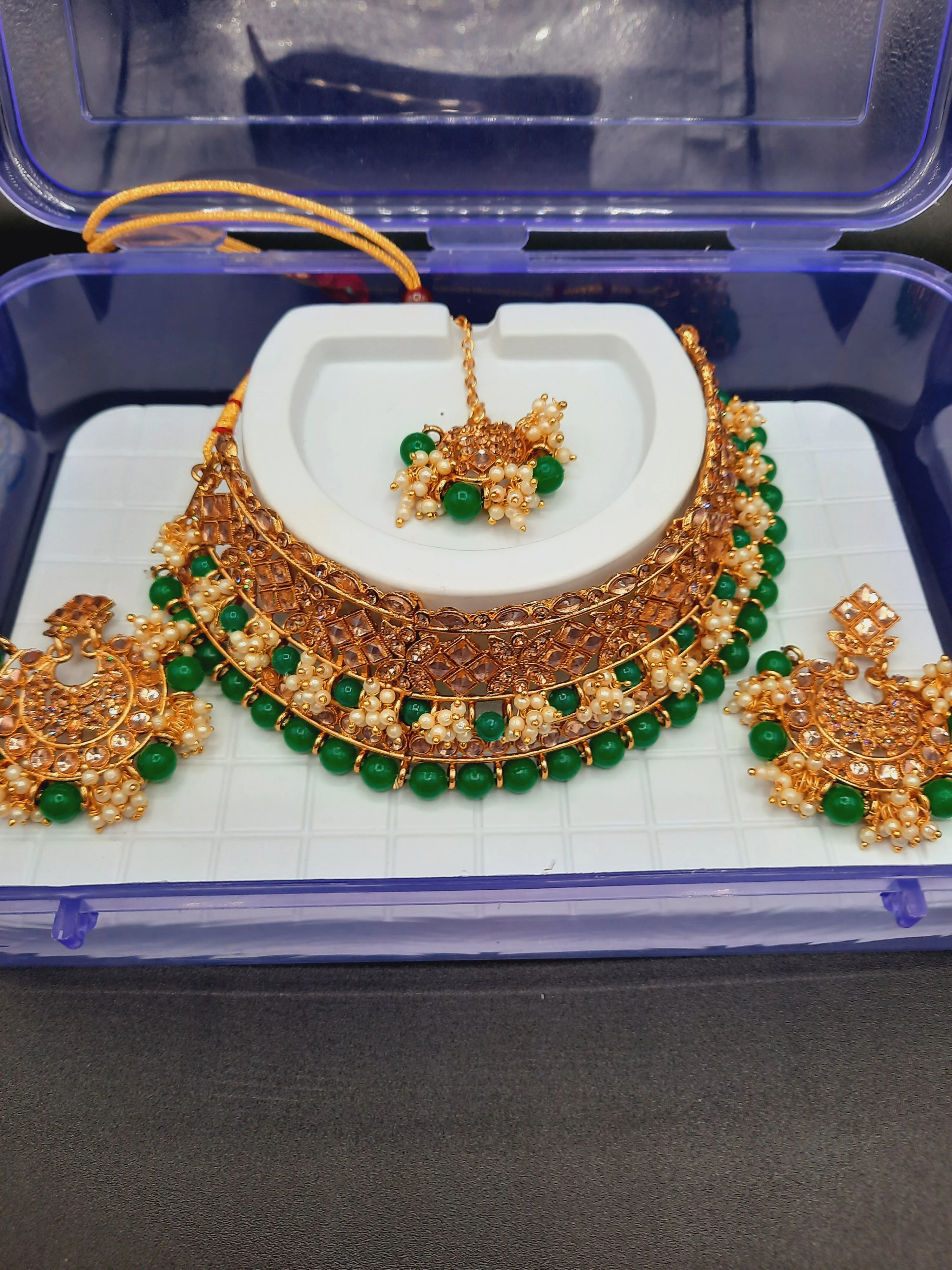 Bridal Jewelry in Golden base with green and off white stones combination