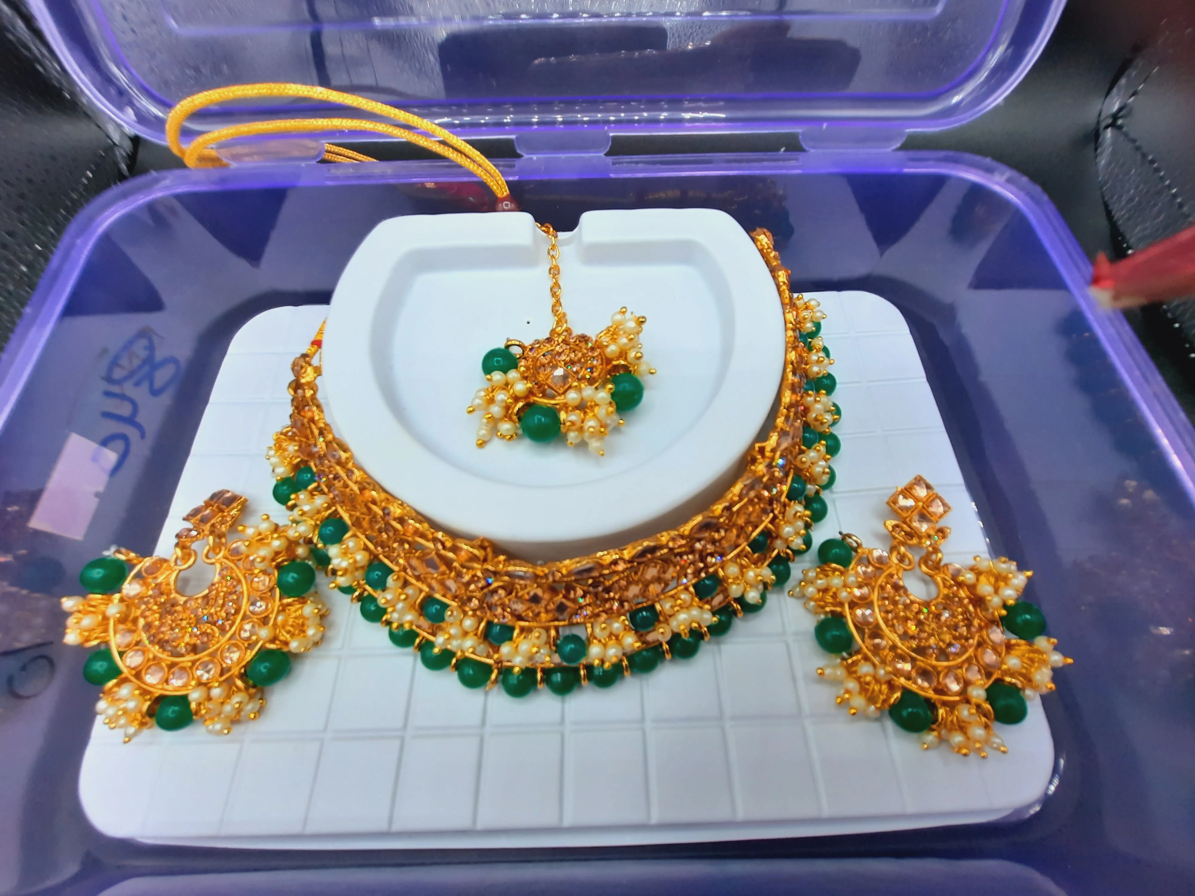 Bridal Jewelry in Golden base with green and off white stones combination